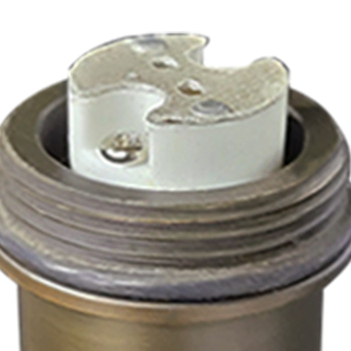 Brass path light set installed in outdoor landscape pathway
